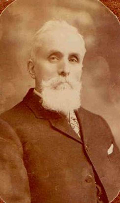 A person with a white beard
Description automatically generated